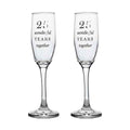 Pair of clear champagne flutes engraved with “25 wonderful years together”, designed to celebrate a 25th wedding anniversary.