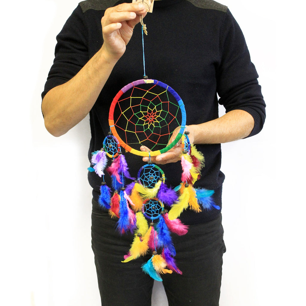 55cm Bali multicoloured dreamcatcher with rainbow feathers, woven web and decorative beads, on a white background