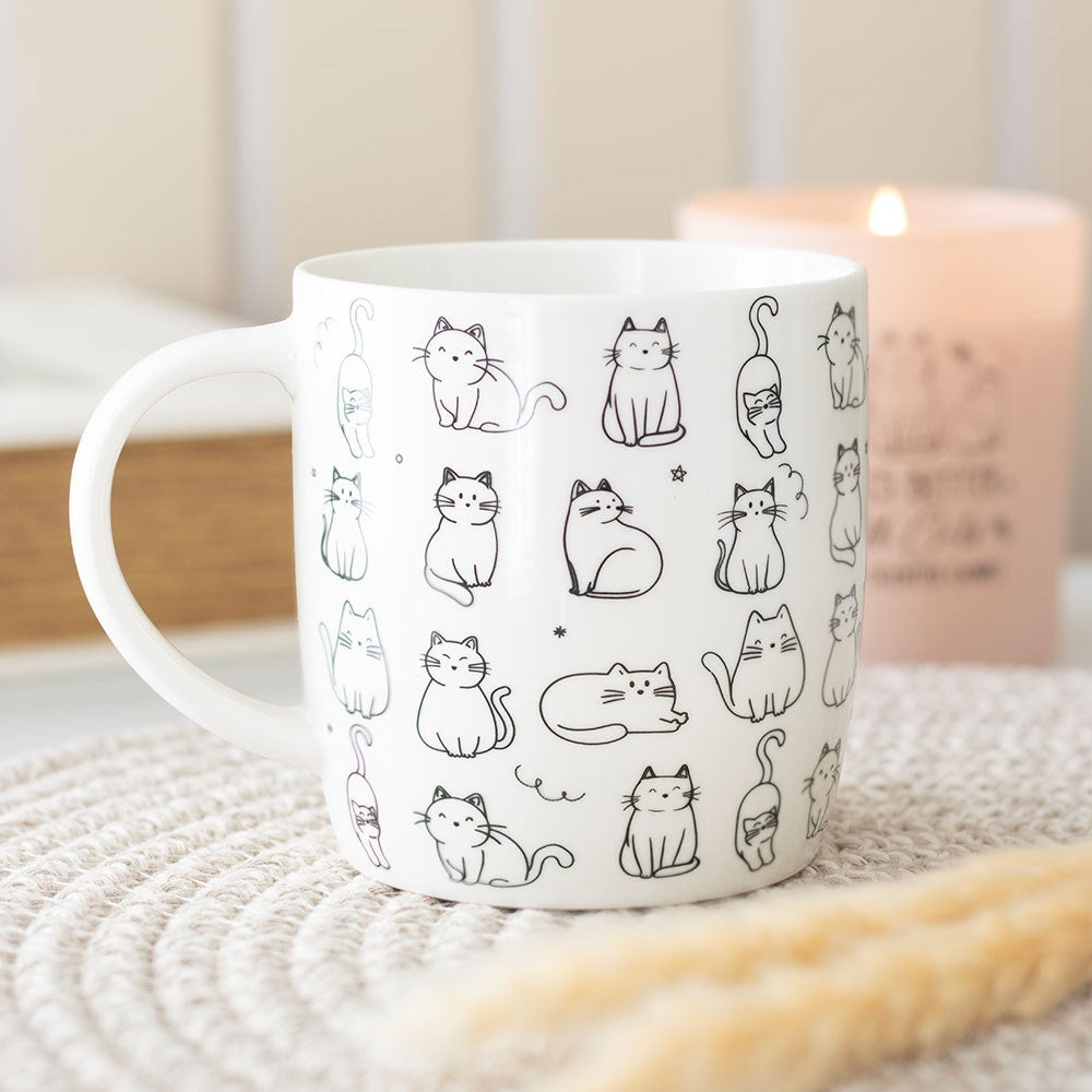 White ceramic mug with happy cats design, cheerful and cosy for everyday use