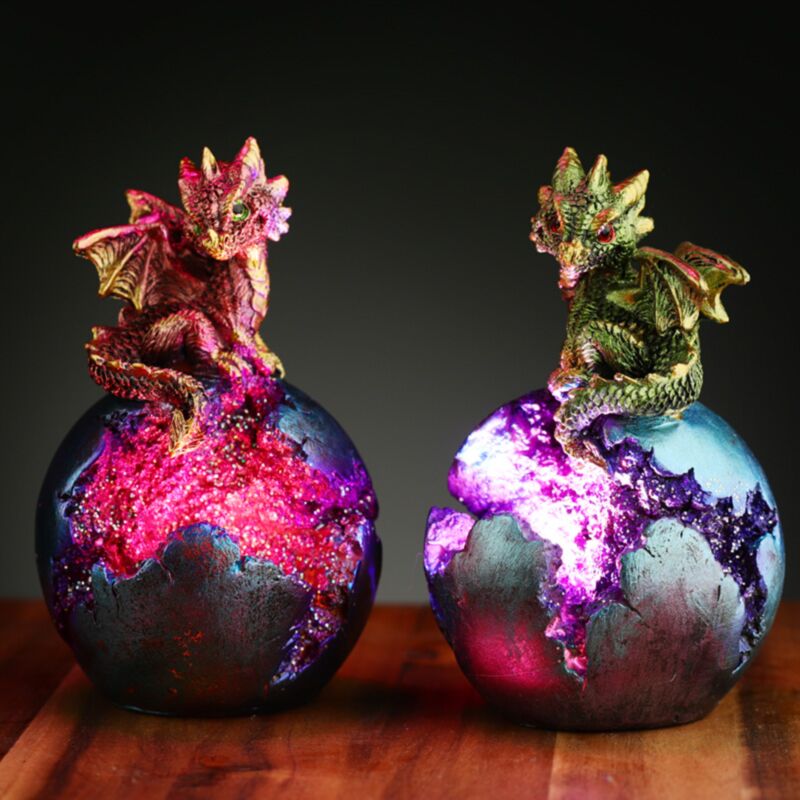 Light up baby dragon ornament emerging from a geode egg with built-in LED lights and fantasy-style detailing.