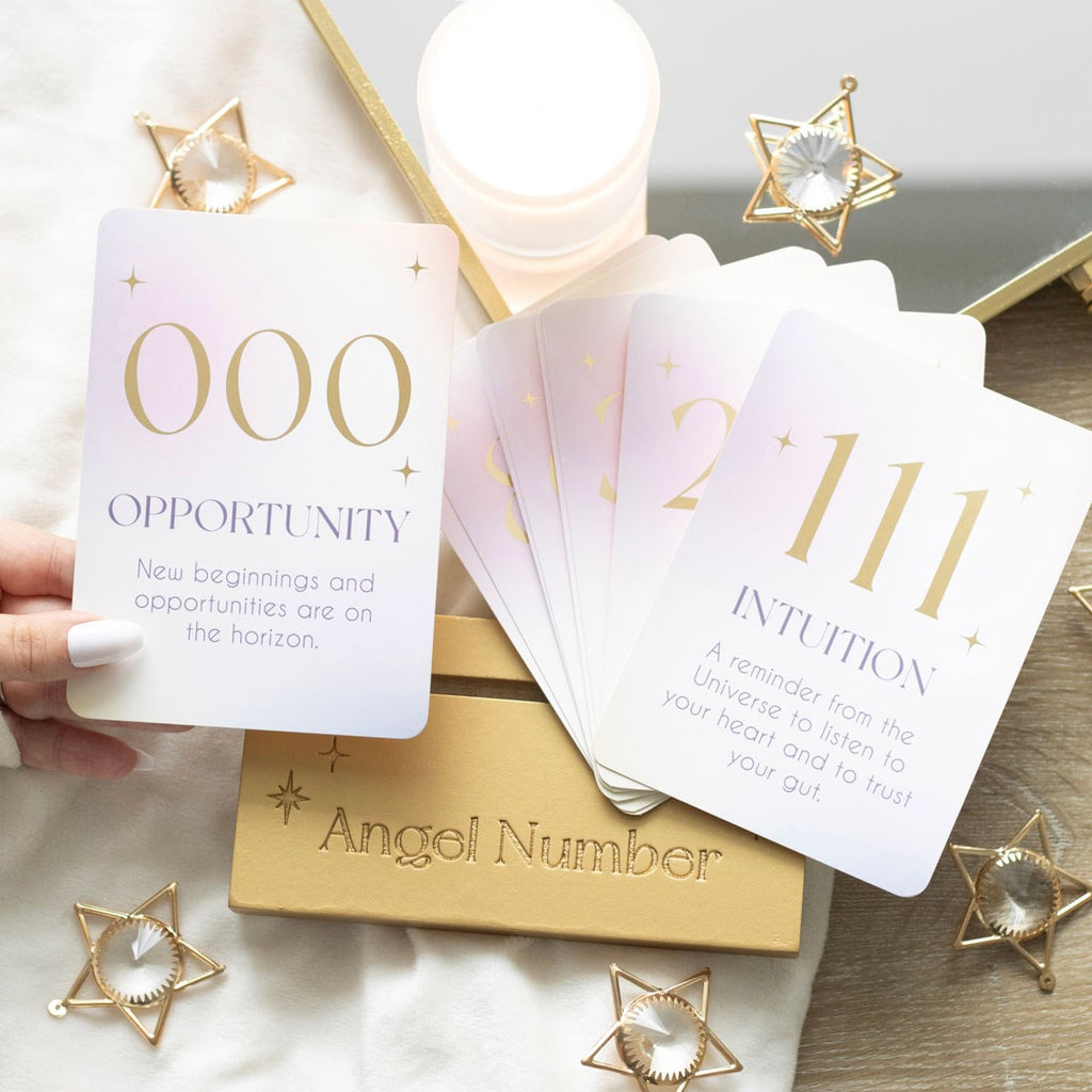 Angel Number affirmation card set with wooden display stand, featuring inspirational messages and spiritual-themed designs.
