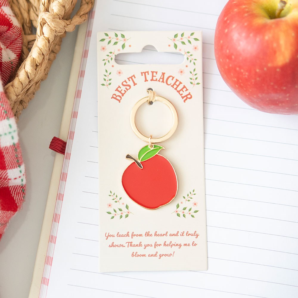 Apple shaped metal keyring featuring “Best Teacher” message with polished decorative finish.