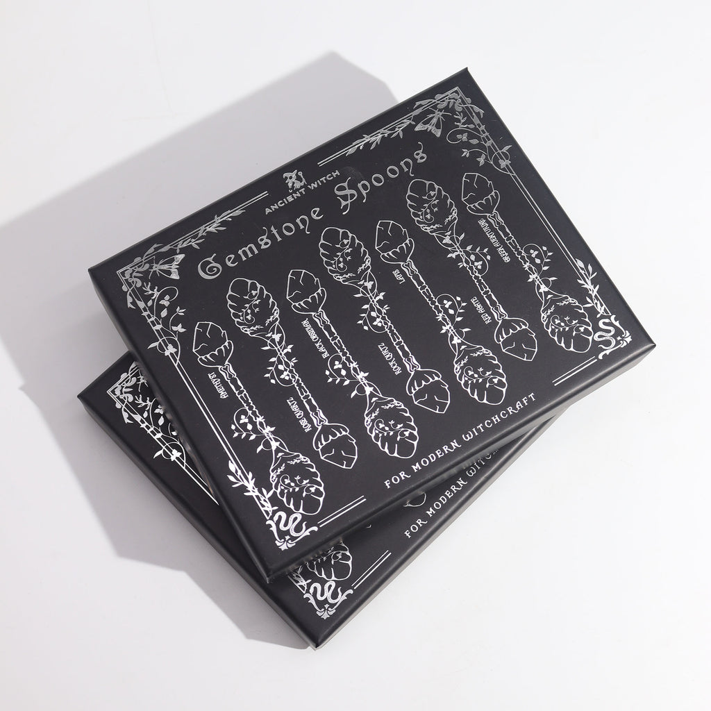 Packaging for 'Gemstone Spoons' with black and white design on a white background
