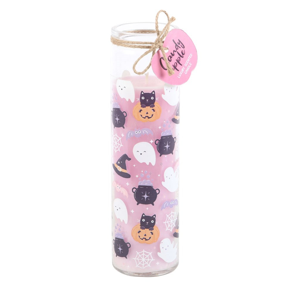 Tall glass tube candy apple scented candle with pastel pink Halloween wrap featuring ghosts, black cats, cauldrons and cobwebs, with a pink circular gift tag and twine bow