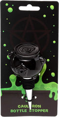 Black ceramic cauldron wine bottle stopper with pentagram detail, displayed on a spooky Halloween branded card backing