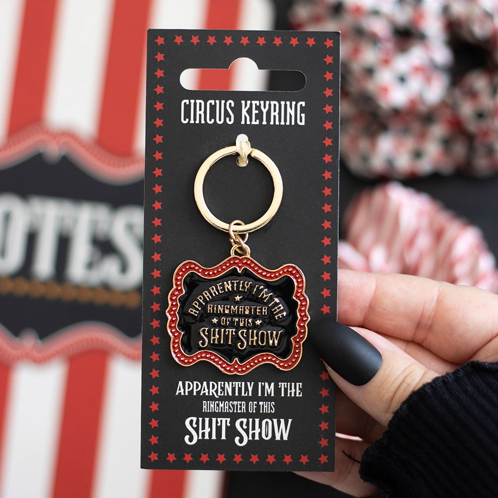 Enamel keyring with “Ringmaster of this shit show” text, bold and humorous accessory