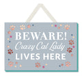 Wooden sign with “Beware a crazy cat lady lives here” quote, fun novelty decor