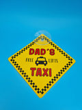 Dad’s Taxi “Free Lifts” suction cup car hanging sign with humorous text for car window display.