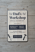 Chunky wooden hanging sign reading “Dad’s Workshop” with rustic style and rope hanger for shed or garage display.