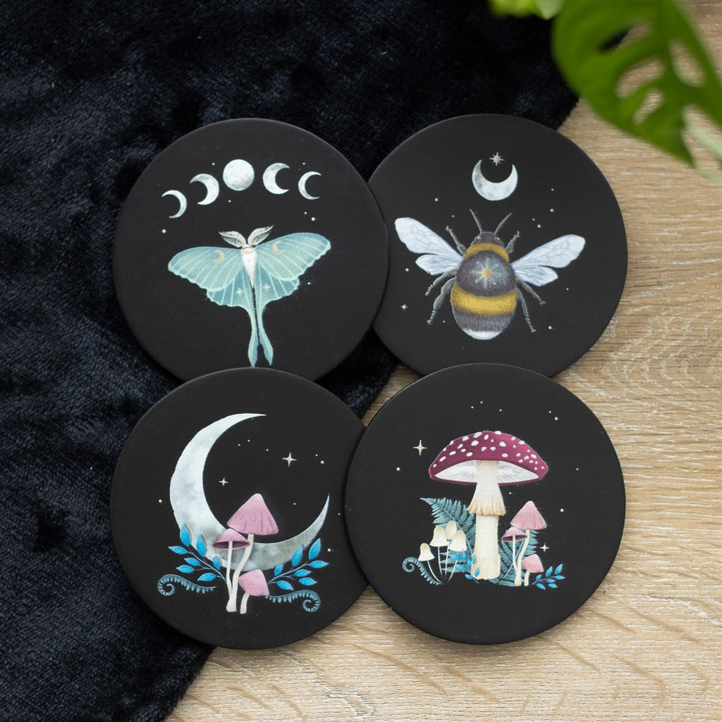 Set of four dark forest-themed wooden coasters with engraved tree design, perfect for protecting surfaces while adding rustic, nature-inspired decor.
