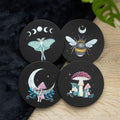 Set of four dark forest-themed wooden coasters with engraved tree design, perfect for protecting surfaces while adding rustic, nature-inspired decor.