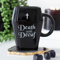 Coffin shaped ceramic mug featuring “Death Before Decaf” text in gothic black design for coffee lovers.