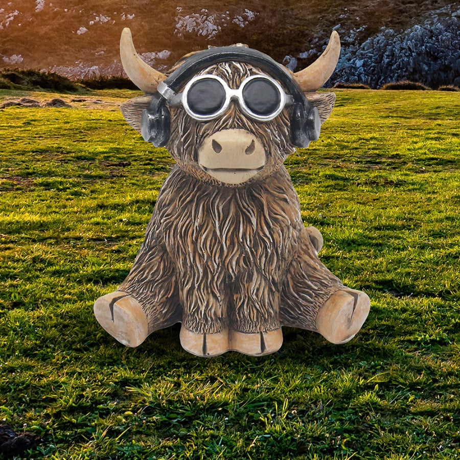 DJ MooSic Highland Cow figurine wearing headphones and glasses, novelty resin ornament with fun music-themed design