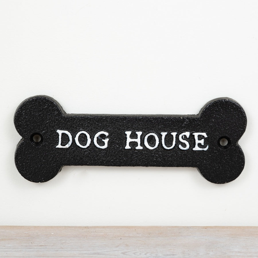 Wall mounted cast iron sign reading “Dog House” in rustic vintage-style lettering with humorous novelty design.