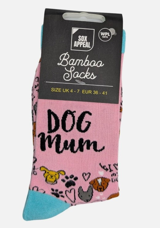 Pink Dog Mum novelty bamboo socks with dog face and paw print illustrations, turquoise cuffs and heels, UK size 4–7, shown in packaging