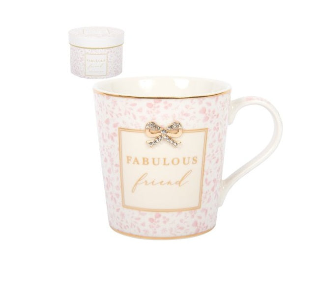 Pink floral china mug with “Fabulous Friend” wording and decorative bow detail, presented with a matching gift box.