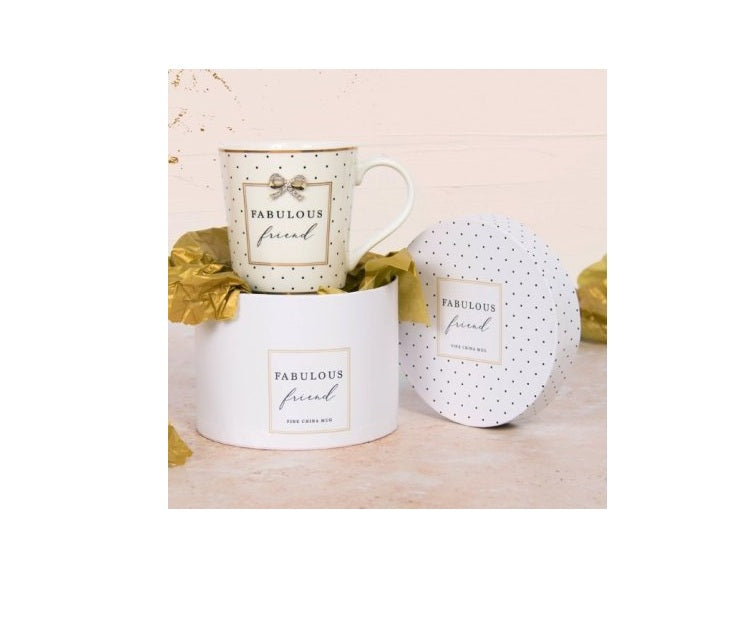 White china mug with “Fabulous Friend” wording presented in a matching decorative gift box with gold accents and spotted design.