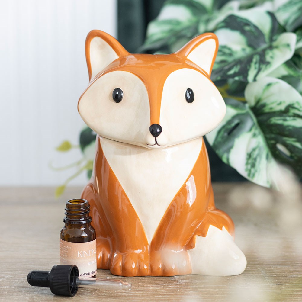 Fox shaped ceramic oil burner and wax warmer with woodland animal design for home fragrance use.