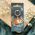 Fox-shaped metal and enamel keyring named Freddie the Fox with detailed woodland-inspired design and attached keyring loop.