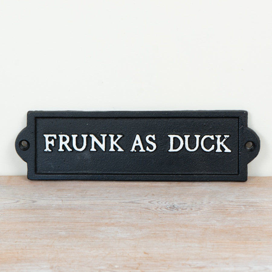 Wall mounted cast iron sign featuring “Frunk As Duck” text with rustic vintage-style humorous design.