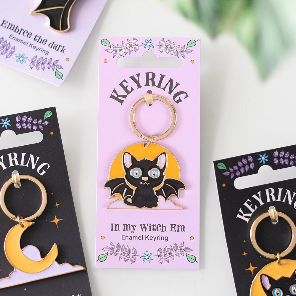 Metal keyring featuring a bat/cat, and full moon design with gothic-inspired detailing and attached keyring loop.