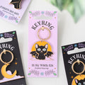 Metal keyring featuring a bat/cat, and full moon design with gothic-inspired detailing and attached keyring loop.