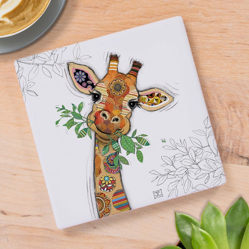 Ceramic coaster featuring Bug Art's Gina Giraffe design with colourful patterned artwork and leafy accents on a light background.