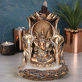Bronze coloured Ganesh backflow incense burner, detailed spiritual decor with cascading smoke effect
