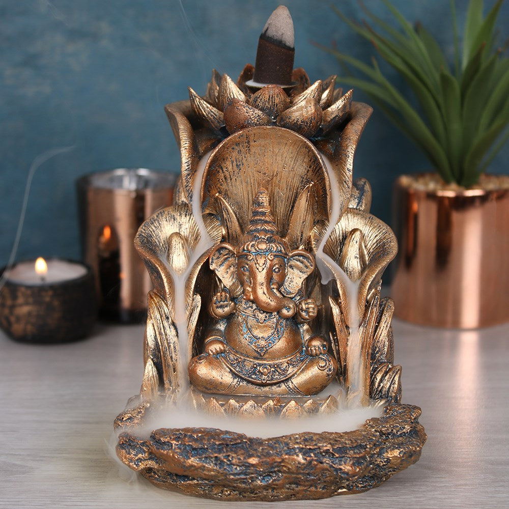 Bronze coloured Ganesh backflow incense burner, detailed spiritual decor with cascading smoke effect
