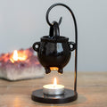 Hanging cauldron style oil burner and wax warmer with gothic witch-inspired decorative design.