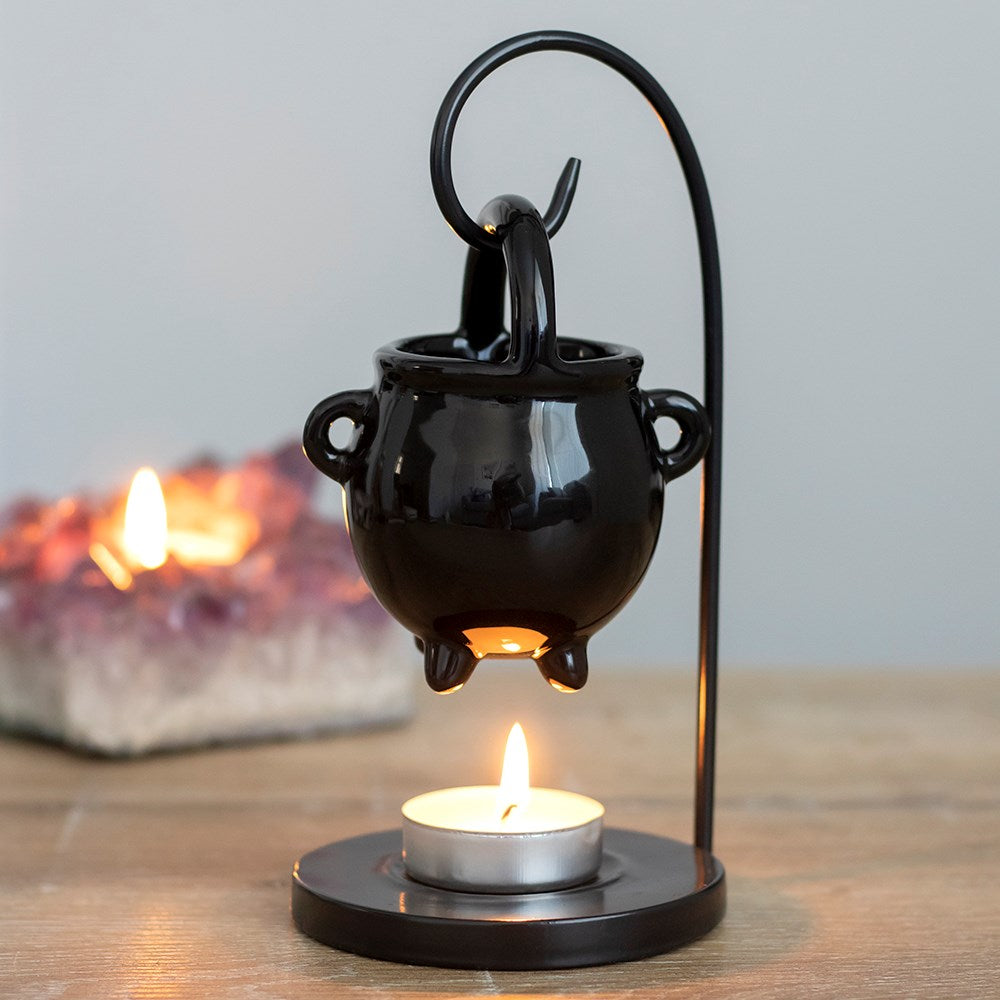 Hanging cauldron style oil burner and wax warmer with gothic witch-inspired decorative design.