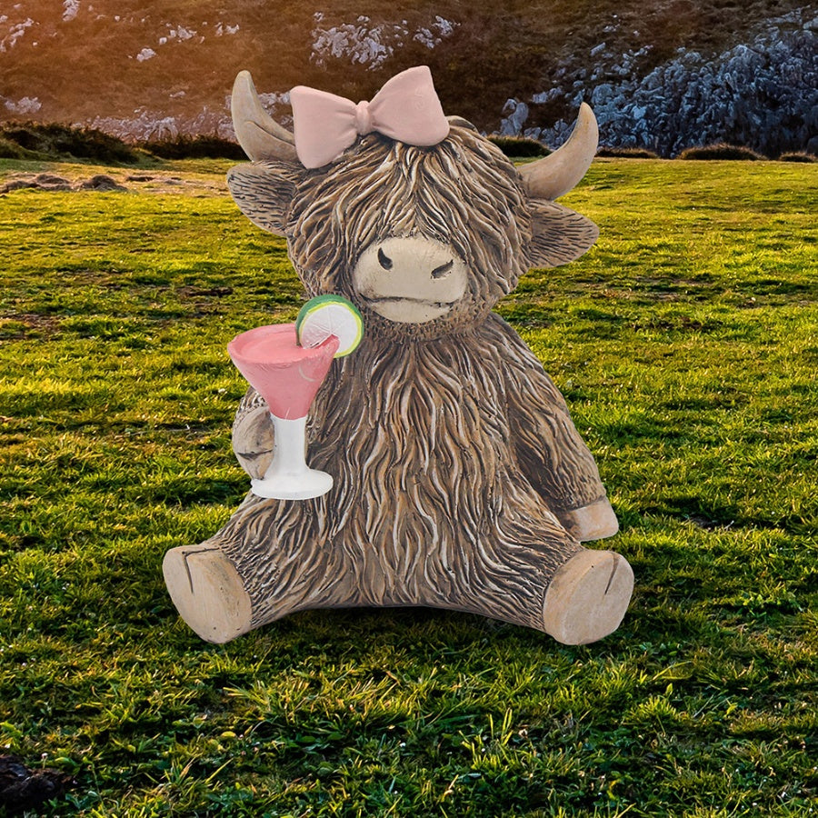 Happy Hour Highland Cow figurine drinking a cocktail, quirky resin animal ornament with fun party theme design