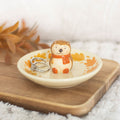 Autumn hedgehog ceramic trinket dish with a hand-painted hedgehog figure and leaf-patterned dish.