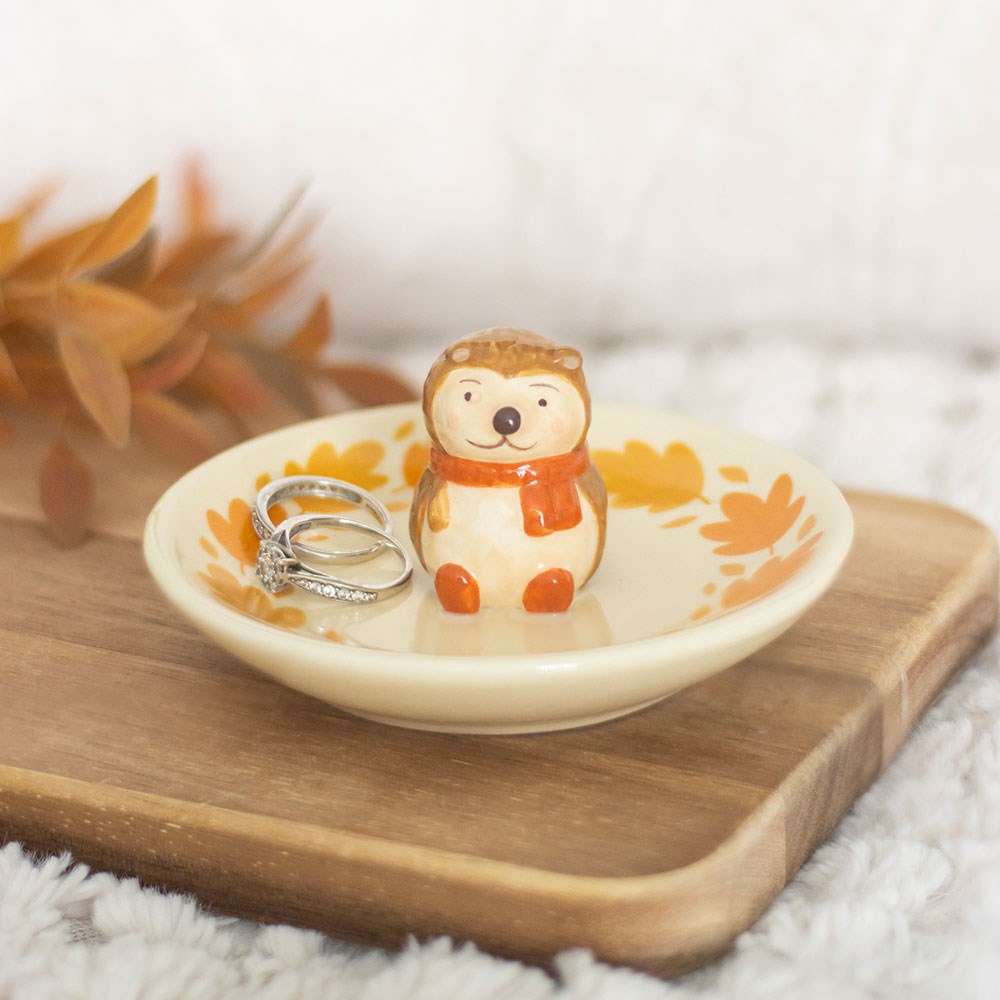 Autumn hedgehog ceramic trinket dish with a hand-painted hedgehog figure and leaf-patterned dish.