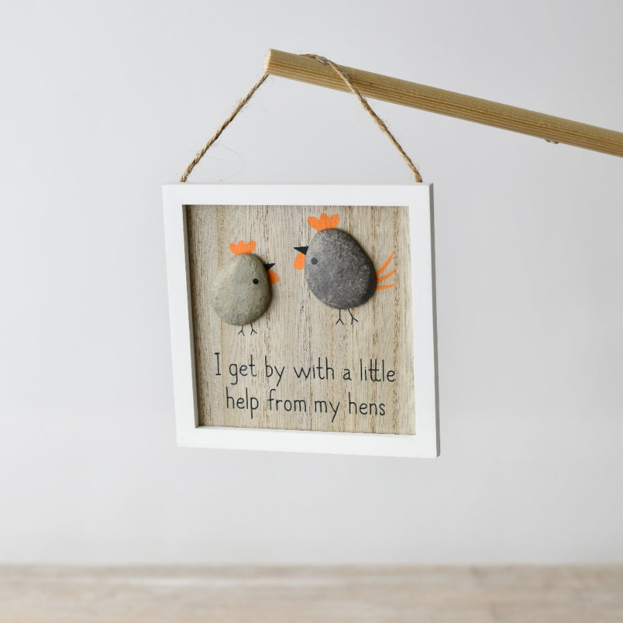Pebble-style decorative sign featuring “With A Little Help From My Hens” text with chicken-themed design.