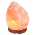 Natural pink Himalayan salt lamp (3–4kg) on a dark wooden base, on a white background