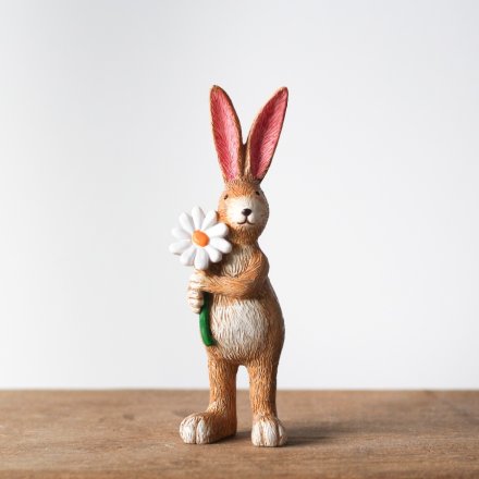 Jasper rabbit holding daisy figurine, a sweet floral-themed ornament