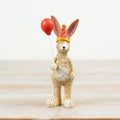 Jasper rabbit holding balloon figurine, a cute and playful decorative ornament with a cheerful design