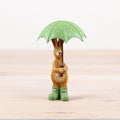 Jasper rabbit holding umbrella figurine, a whimsical ornament with a cosy and playful feel