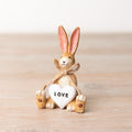 Mini Jasper rabbit love figurine, a cute decorative piece representing affection and care