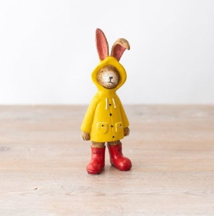 Jasper rabbit yellow raincoat figurine, a playful decorative piece with bright detail