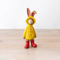 Jasper rabbit yellow raincoat figurine, a playful decorative piece with bright detail