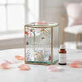 Loveliest Mum floral glass oil burner on marble surface with rose petals and wax melt cube
