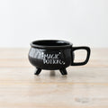 Magic Potion Black Ceramic Cauldron Mug with three legs and handle, featuring white "Magic Potion" text on a glossy black finish.