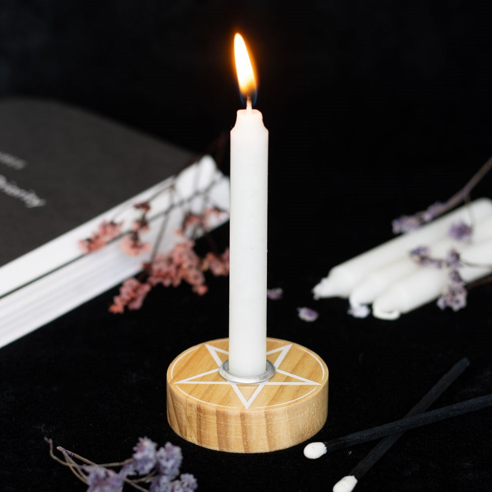 Natural wooden pentagram spell candle holder with engraved mystical symbol and rustic finish.