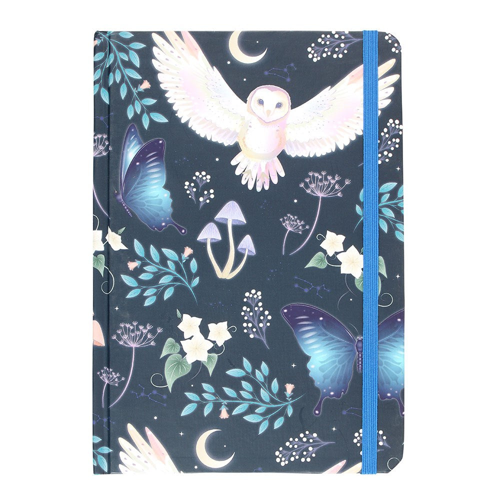 A5 lined notebook with a dark navy cover featuring a white barn owl in flight surrounded by blue morpho butterflies, pastel mushrooms, crescent moons, dandelion clocks, and teal botanical leaves, with a blue elasticated closure.