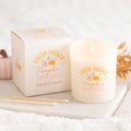 Frosted glass pumpkin spice latte scented candle with gift box, styled with matches, a pink pumpkin and autumn leaves on a white tray