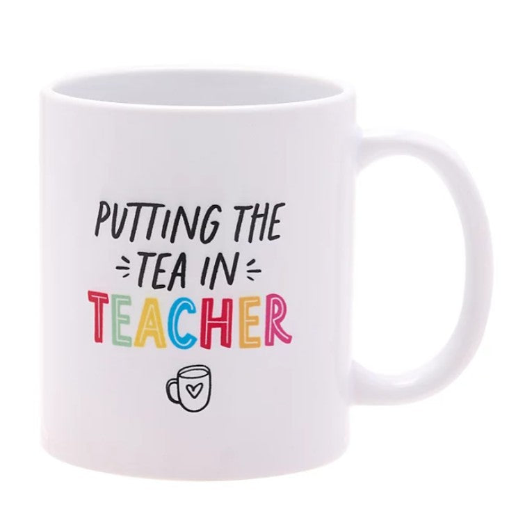 Ceramic mug featuring “Putting The Tea In Teacher” printed text with teacher-themed decorative design.