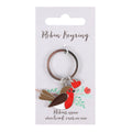 Silver metal keyring with enamel robin bird charm holding a red heart, presented on a Robin Keyring sentiment card with floral design and remembrance verse