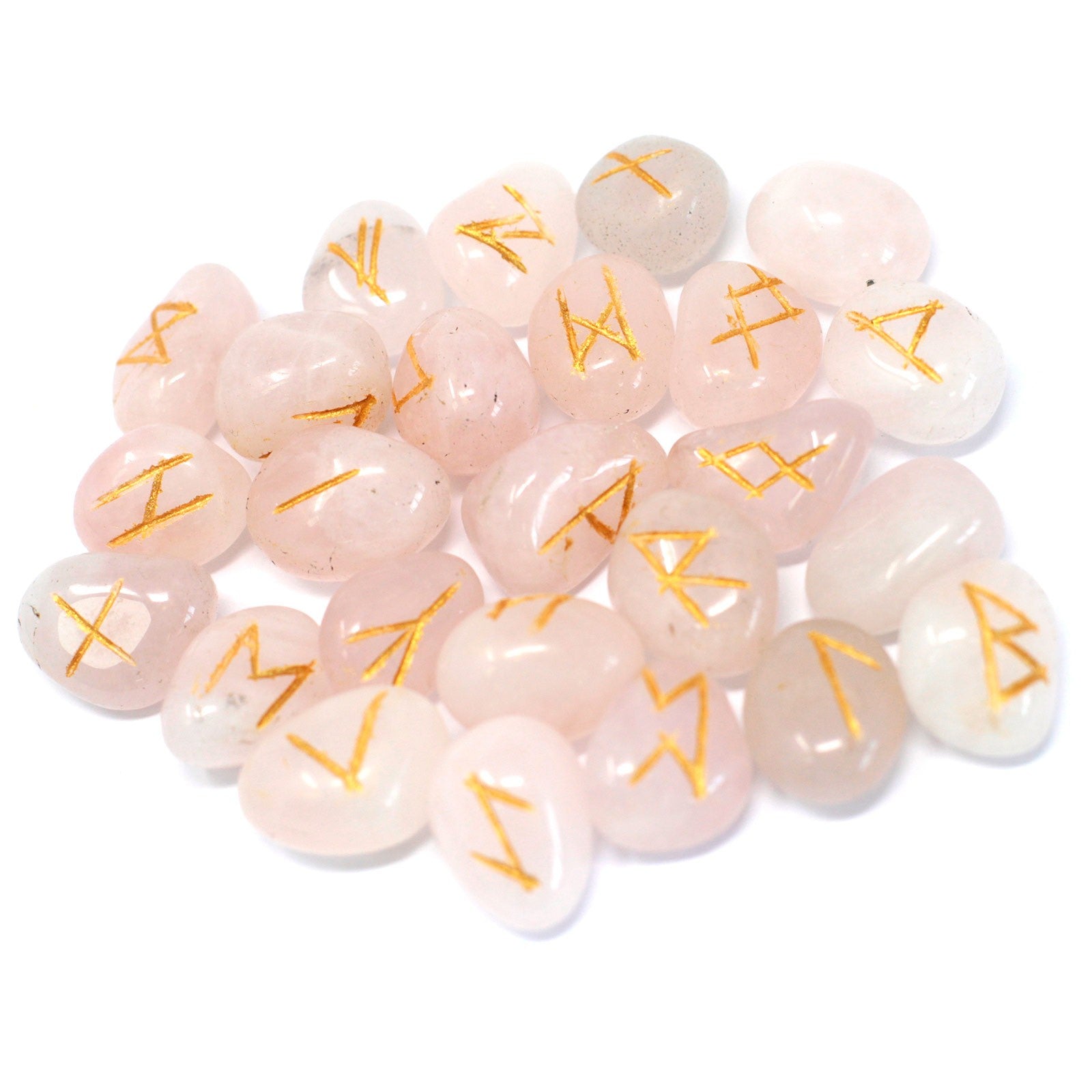 Rose quartz rune stone set featuring engraved symbols on polished pink gemstone pieces used for divination and spiritual practices.
